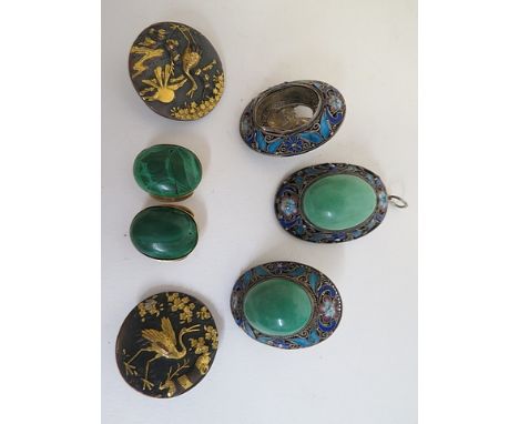 Three white metal filigree and enamelled cabochon pendants, two set with green jade coloured stone, two Chinese gilt and brow