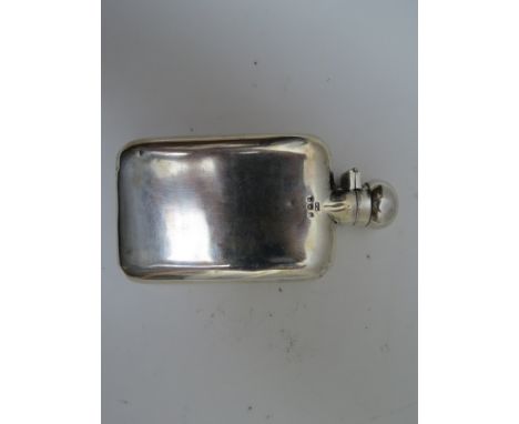 A George V silver hip flask of curved form, Henry Matthews Birmingham 1917, with a rotating hinged cap