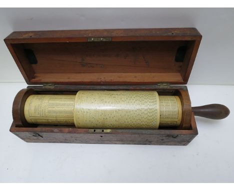 A Fuller rotary calculator with a mahogany handle and ends, 17 high overall in a mahogany case