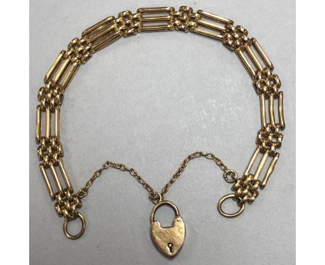 A gatelink bracelet with padlock catch, and integral safety chain, clasp stamped '9c', 7.1g  