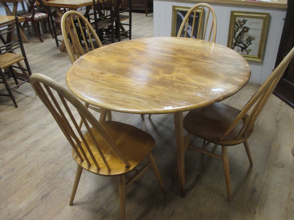 An Ercol table and 4 chairs in Cheffins Fine Art