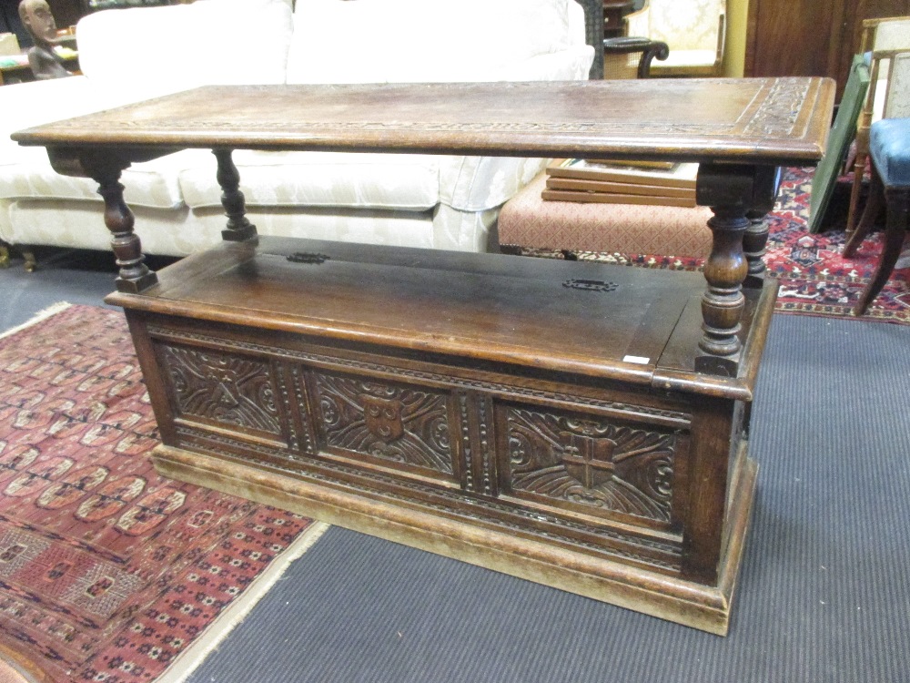 A 1920 S Carved Oak Monks Bench With Folding Back And Box Seat