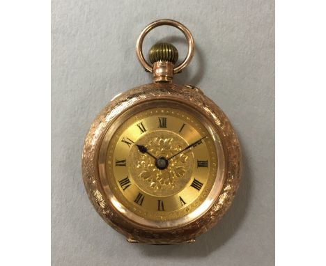 A 9ct gold lady's open faced pocket watch, crown wind movement stamped 'Made in Switzerland' with hand setting button at one 