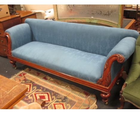 A William IV mahogany frame sofa, upholstered in a blue damask fabric with carved show wood, on turned legs, 230cm wide  