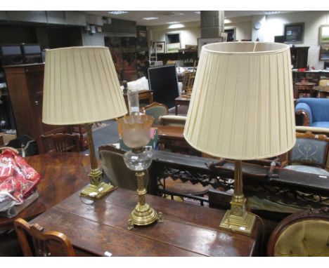 A pair of 20th century brass corinthian column table lamps laps 50cm high, together with a Victorian oil lamp and glass shade