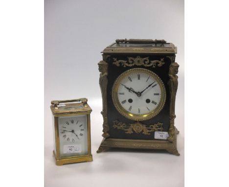 An Edwardian brass carriage clock, together with a French ebonised cased mantle clock, with battery movement (2) 