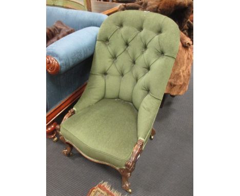 A 19th century rosewood framed button-back armchair  