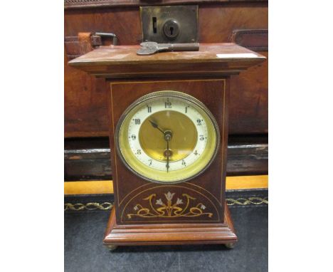 An Art Nouveau inlaid mahogany mantle clock, 28cm high  