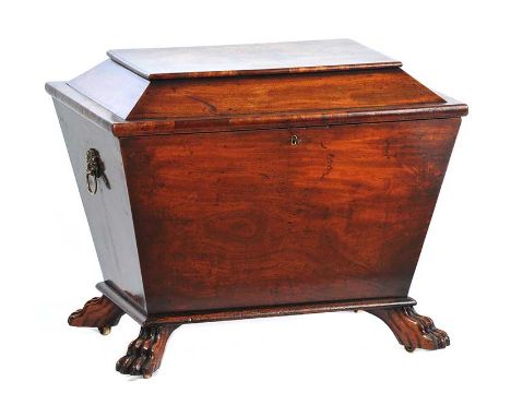 REGENCY MAHOGANY SARCOPHAGUS CELLARETTE WITH BRASS RING HANDLES AND FOUR PAW FEET HEIGHT: 23 INCHES WIDTH: 27 INCHES DEPTH: 1