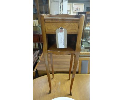 SOLD IN TIMED AUCTION
A pair of French Kingwood bedside tables with frieze drawer above shelf on slender supports 