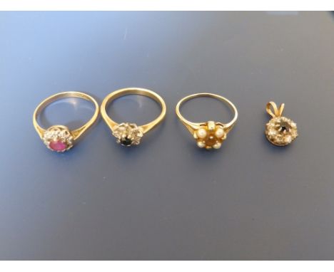A small ruby &amp; diamond cluster ring, two other cluster rings and a pendant. (4)
