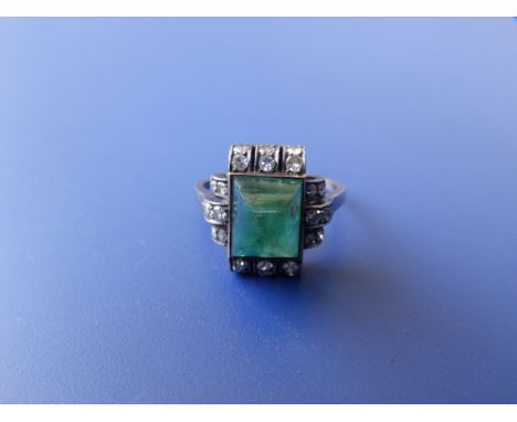 An emerald &amp; diamond set dress ring. Finger size K/L