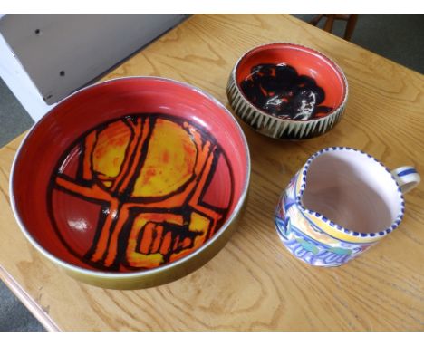 A Poole Delphis fruit bowl by Carol Cutler, a Poole milk jug - 'XP' decorated bluebells and one other Poole bowl. (3)