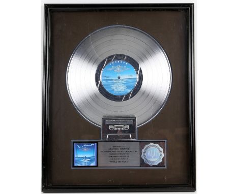 Journey - 'Raised on Radio', platinum sales award presented to Jonathan Smeeton to commemorate the sale of more than 1,000,00