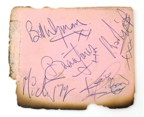 The Rolling Stones - A set of Autographs, circa 1960's signed on an album page, signed in blue by Mick Jagger, Keith Richards