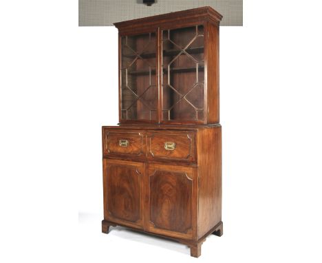 A Georgian mahogany secretaire bookcase. With dentil cornice above astragal glazed double doors enclosing two adjustable shel