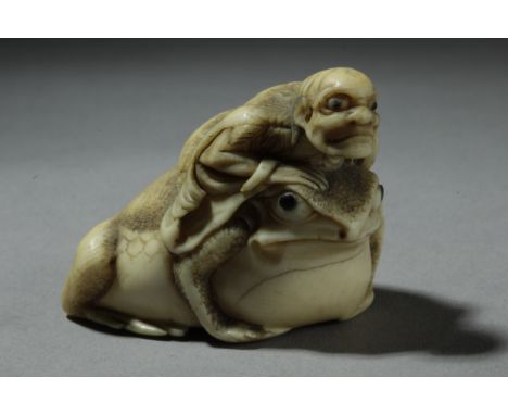 A mid 19th century Japanese netsuke from Edo period. In carved ivory depicting a "Gama Sennin" riding a big toad with horn ey