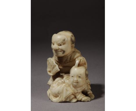 A mid 19th century Japanese netsuke. Signed on the base. A carved ivory portraying two kids playing, the eldest wearing a Nho