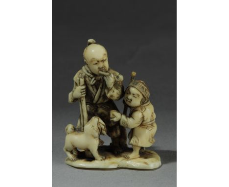 A mid 19th century Japanese netsuke from Edo period. Signed Minkoku on the base. In carved ivory portraying a group of figure