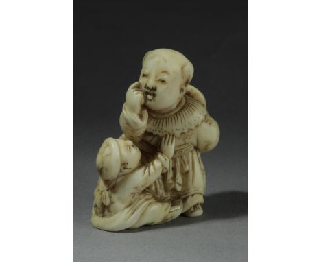 A mid 19th century Japanese netsuke from Edo period. Signed Masatoshi on the back. In carved elephant ivory portraying a stan