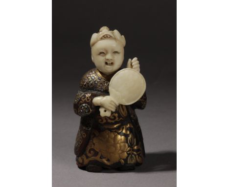 A late 19th century Japanese netsuke circa 1880. In carved ivory and wood, Burgote lacquer and mother of pearl inlaid depicti