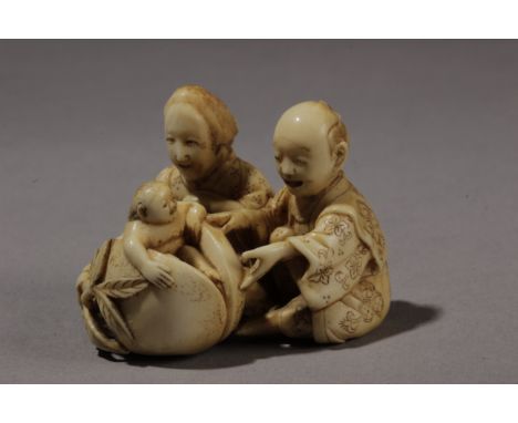 A late 19th century Japanese netsuke. Attributed to Masatami. Not signed. In carved elephant ivory portrayinga couple opening