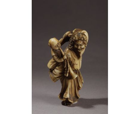 A mid 19th century Japanese netsuke from Edo period. In carved ivory portraying a standing Dutch, who is holding with both ha