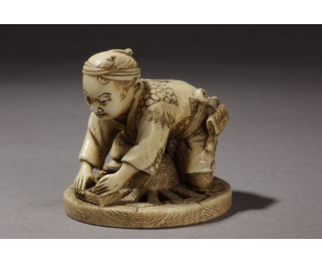 A late 19th century Japanese netsuke from Meiji period. Signed Gyokko on a red kanji. In carved elephant ivory portraying an 