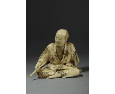 A 19th century Japanese okimono from Meiji period. Signed on the base. In carved ivory portraying a sat Japanese costumbrist 