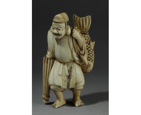 A mid 19th century Japanese netsuke from Edo period. Signed Shigyoku on the base. In carved ivory depicting a standing "Ebisu