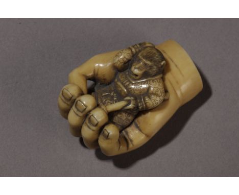 A Japanese netsuke from Taisho period. Signed Masatoshi on the back. In carved elephant ivory portraying "Songoku" the monkey