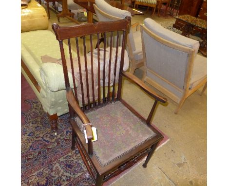 A C20th provincial stick back open armchair with floral needlework seat