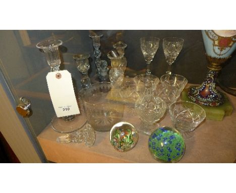 A collection glassware including paperweight, candlestick and glasses