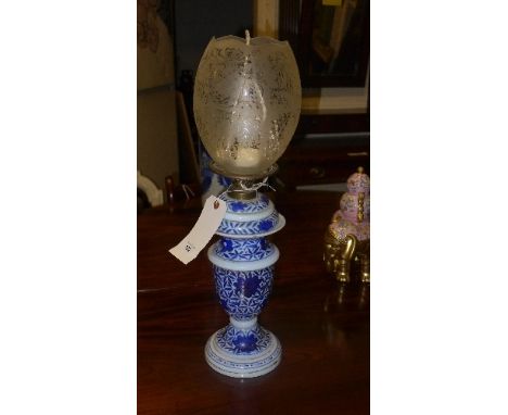 A blue painted opaline oil lamp 