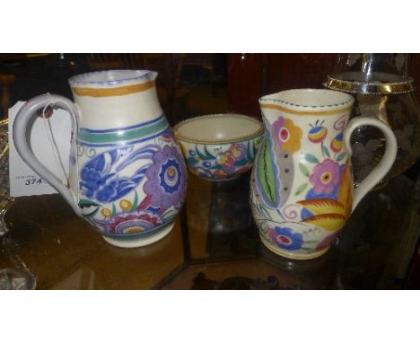 A Poole pottery water jug, similar and Poole pottery bowl