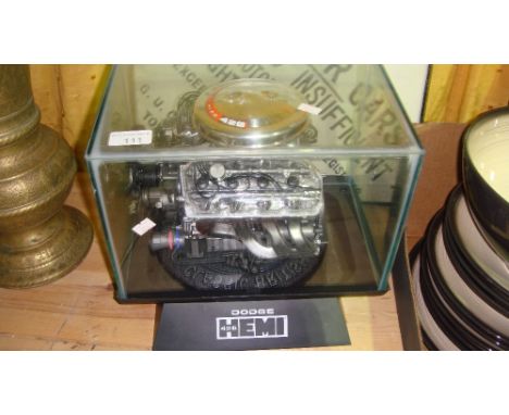 Dodge 426 HEMI engine head mounted as a desk top model in case