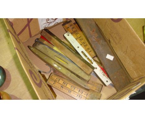 Box of assorted antique and vintage measures, brass top levels, scales etc.