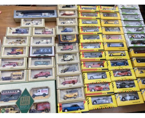 A box containing a collection of boxed diecast vehicles including Lledo Days gone , Shell and BP cars