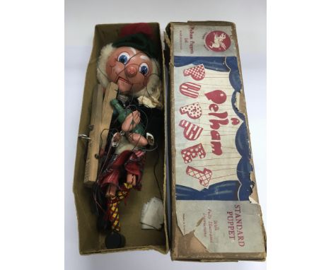 A boxed Pelham puppet.