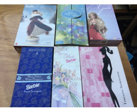 A collection of boxed Barbie dolls by Mattel