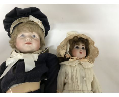 Two bisque headed dolls fitted in Edwardian style dress