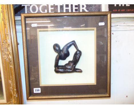 A bronze figure on glazed frame