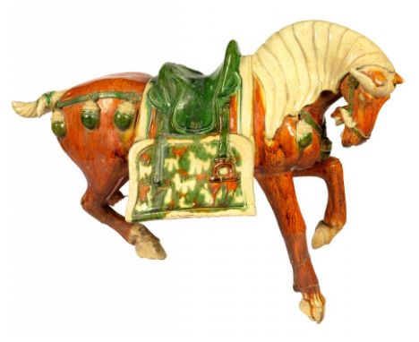 A CHINESE SANCAI GLAZED POTTERY MODEL OF A HORSE, TANG DYNASTY STYLE 43cm h++Legs broken and restuck, lacking part of one bac