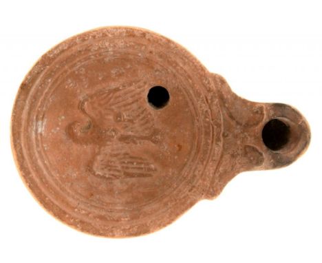 ANTIQUITIES.  A ROMAN POTTERY OIL LAMP,  C SECOND CENTURY AD 9cm l++No substantial breaks or chips