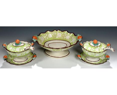 A PAIR OF RIDGWAY MOULDED EARTHENWARE SAUCE TUREENS, COVERS, LADLE AND SIFTER, C1820 with apple green ground, 15cm h and a fr