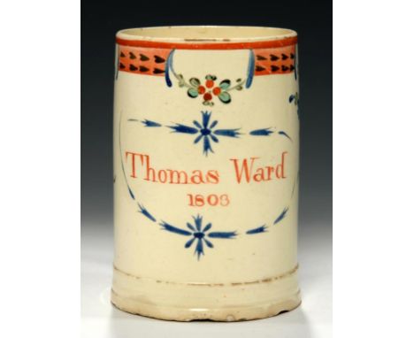 A CREAMWARE MUG, DATED 1803  painted with paterae and stylised flowers flanking the inscription Thomas Ward 1803, 12.5cm h++R