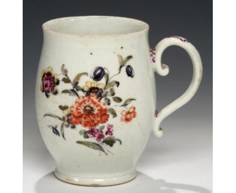 AN EARLY DERBY POLYCHROME MUG, C1756-58  enamelled in the manner of the 'Cotton Stalk' painter, the handle picked out in puce