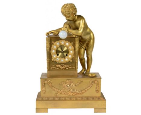 A CHARLES X ORMOLU MANTEL CLOCK, C1830 the rectangular base surmounted by the figure of a boy with two seashells blowing an o