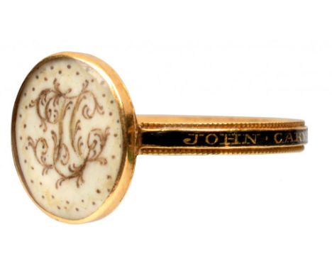 A GEORGE III GOLD AND ENAMEL MOURNING RING  the tablet painted in sepia with the initials JC on ivory, the hoop inscribed JOH