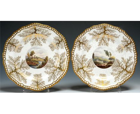 A PAIR OF SPODE GADROONED DESSERT PLATES IN WORCESTER STYLE, C1820  with painted landscape and seaweed gilding, 22.5cm diam, 